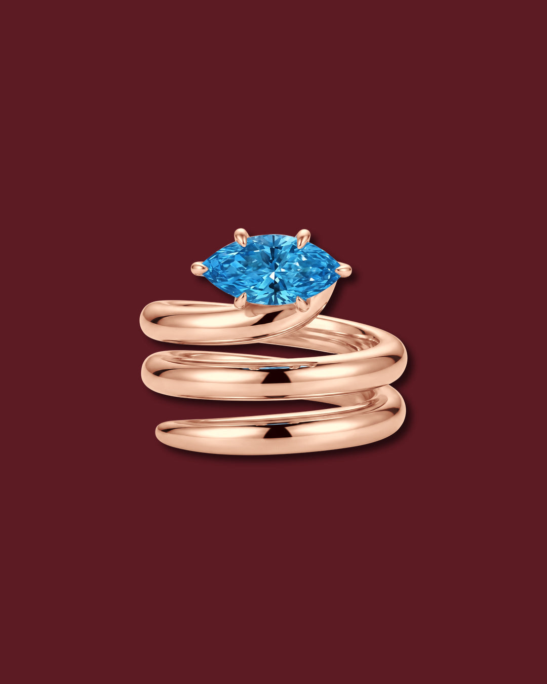 NAIYA pinky ring in rose gold, set with a marquise lab-grown blue diamond