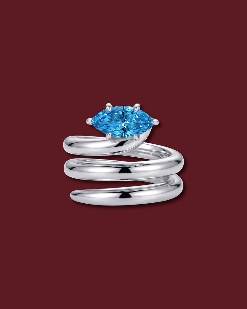 NAIYA pinky ring in white gold, set with a marquise lab-grown blue diamond