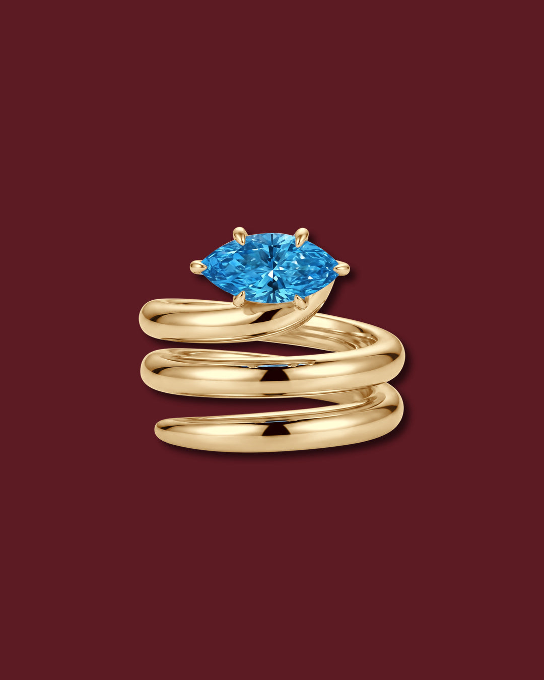 NAIYA pinky ring in yellow gold, set with a marquise lab-grown blue diamond