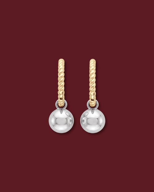 Back of the CHANTAL charm, a polished 14K white gold ball, on a 14K yellow gold twisted huggie