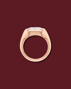Rose gold THALIA signet ring seen in profile, showing the marquise flush in the dome